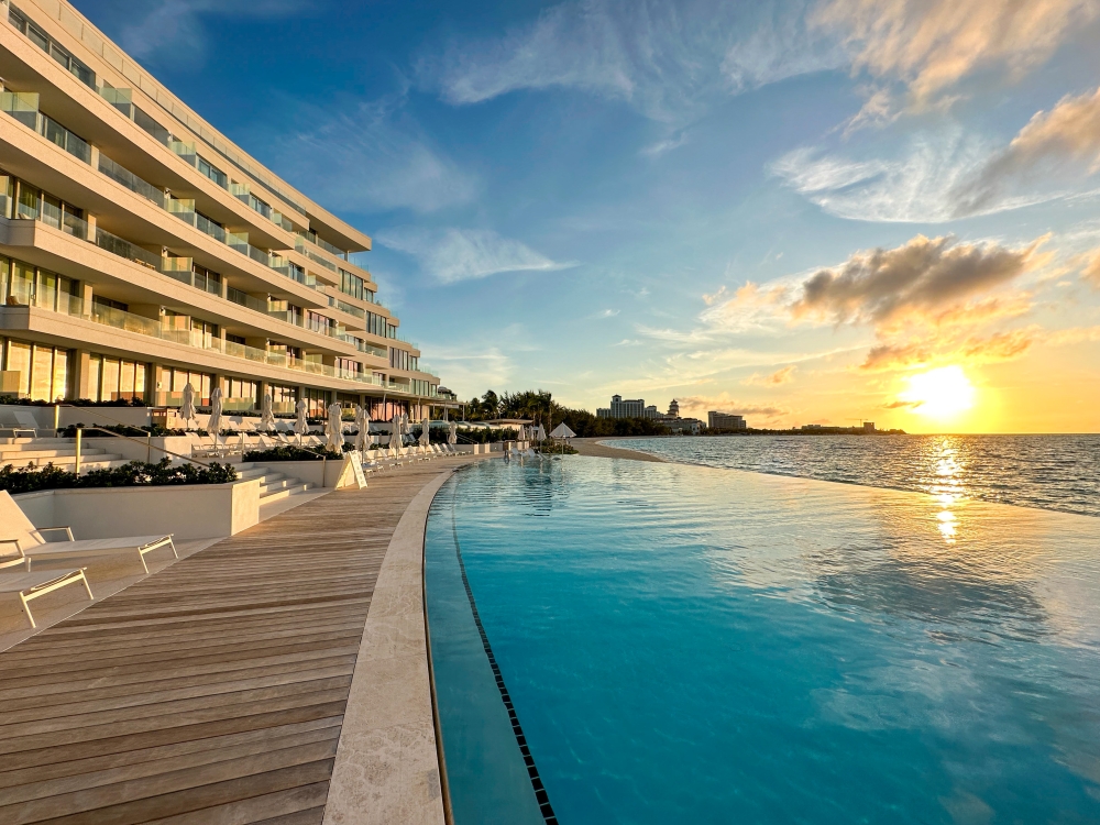 hotel and pool with sunset 